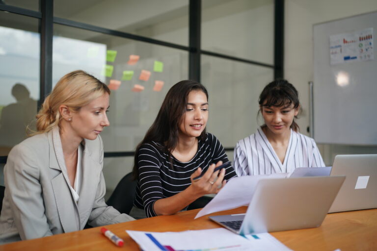 business people have a meeting about company statistics